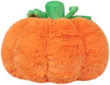 Plush pumpkin toy with green stem on a white background