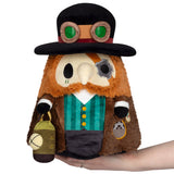 Steampunk-themed plush toy held in a hand on a white background