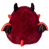 Red plush toy with black horns and wings on a white background