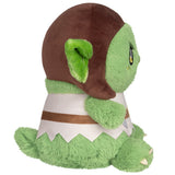 Green plush toy with brown hood on a white background