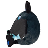 Plush toy of a dark blue creature with black ears on a white background
