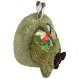 Plush toy resembling a green creature with rabbit ears on a white background