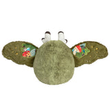 Green plush toy with colorful designs on a white background