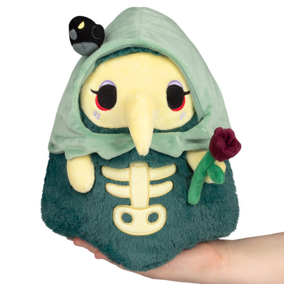 Plush toy with skeleton design and hood on a white background