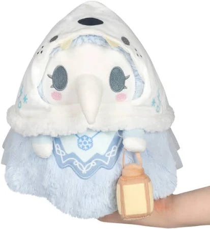 Plush toy resembling a character with a white hood and blue accents, held in a hand against a white background.