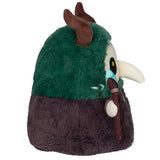 Plush toy resembling a character with green top and brown bottom, holding a staff.