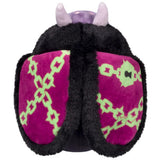 Plush toy with purple and green patterned wings on a white background