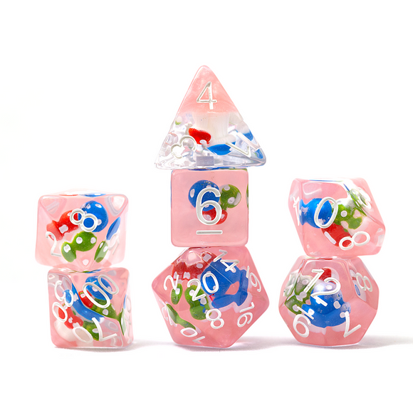 Set of pink dice with colorful numbers and characters on a white background