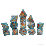 Set of blue dice with gold and red patterns on a white background