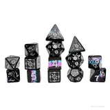 Set of black polyhedral dice with colorful numbering on a white background