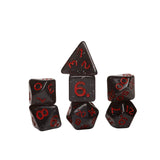 Set of black dice with red numbers on a white background