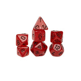 Set of red polyhedral dice with black numbers on a white background