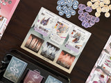 Collection of fantasy-themed cards on a wooden surface with decorative elements.