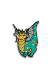 Enamel pin with a dragon design on a white background