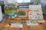 Board game 'Wingspan' with components on a wooden table