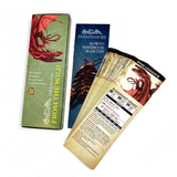 Collection of gaming books and cards with dragon illustrations on a white background