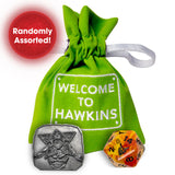 Green drawstring bag with 'Welcome to Hawkins' text, featuring a silver coin and orange dice on a white background.