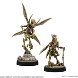 Two miniature figures on stands with a white background