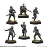 Six miniature figures of soldiers in tactical gear on round bases with a white background.
