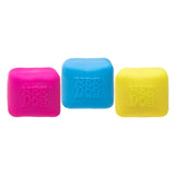 Three colorful dog chew toys with 'Nee Doh' branding on a white background