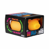 Yellow toy pig in a black box with colorful text on a white background