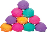 Colorful plastic dog-shaped toys stacked on a white background