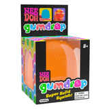 Box of Nee Doh Gumdrop toy with colorful design and orange ball inside