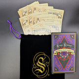 Sage Stones Multiverse Card Expansion with cards and black drawstring bag on gray background