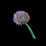 Decorative flower with purple and green colors on a black background