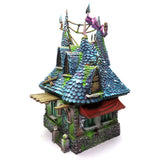 Fantasy miniature building with a detailed roof on a white background