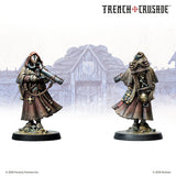 Two miniature figures from 'Trench Crusade' with a blurred background featuring a building.