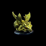 Gold dragon figurine on a black background