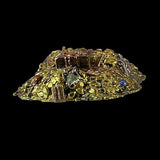 Decorative piece with gold and multicolored stones on a black background