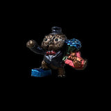 Decorative figurine of an owl in a suit holding flowers and a gift on a black background