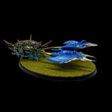Blue fantasy creature on a round green base with a black background