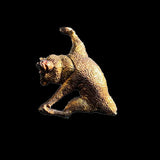 Bronze sculpture of a bear on a black background