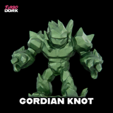 Green robot figurine named 'Gordian Knot' on a black background with 'Turbo Dork' branding.