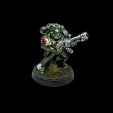 Miniature figure of a space marine with a weapon on a black background