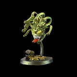 Metallic dragon figurine on a black background