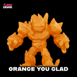 Orange robot figurine with 'Turbo Dork' branding on a black background
