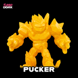 Yellow action figure named 'Pucker' with 'Turbo Dork' branding on a black background