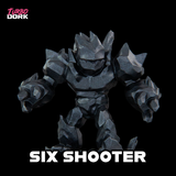 Toy figure labeled 'Six Shooter' with 'Turbo Dork' branding on a black background