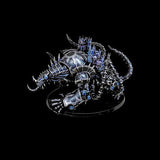 Metallic dragon figurine with detailed scales and blue gemstones on a black background