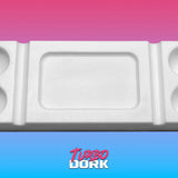 White foam block with cutouts on a gradient pink to blue background, featuring the brand 'Turbo Dork'.