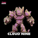 Toy figure with purple and beige color scheme on a black background, branded 'Turbo Dork'.
