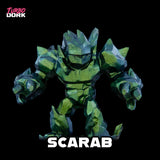 Toy figure of a scarab with 'Turbo Dork' branding on a black background