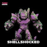Toy figure with purple and green color scheme on a black background, featuring the brand 'Turbo Dork'.