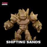 Toy figure of a creature with sand-like texture on a black background, branded 'Turbo Dork'.