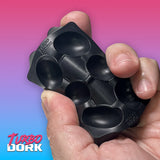 Black ice cube tray held in a hand with a colorful gradient background, featuring the brand 'Turbo Dork'.