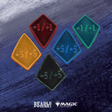 Five diamond-shaped game tokens with different colors and numbers on a textured blue background, featuring Beadle & Grimm's and Magic: The Gathering logos.